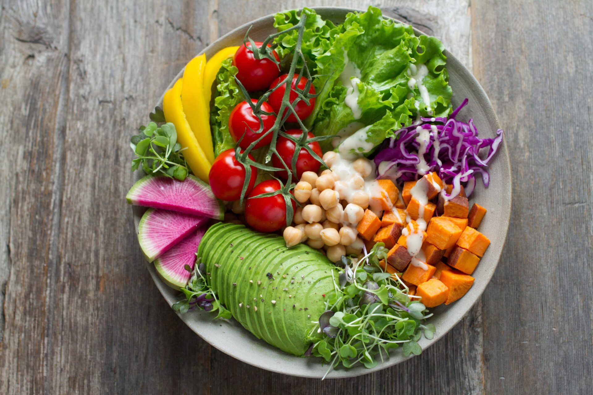 plate of vegetables and chickpeas with creamy dressing