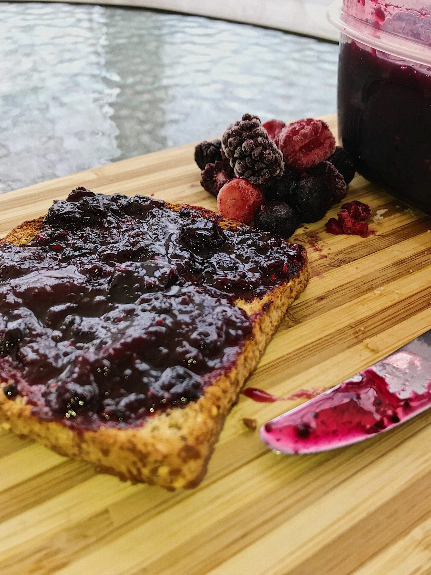 mixed berry jam with frozen berries and jar of jam