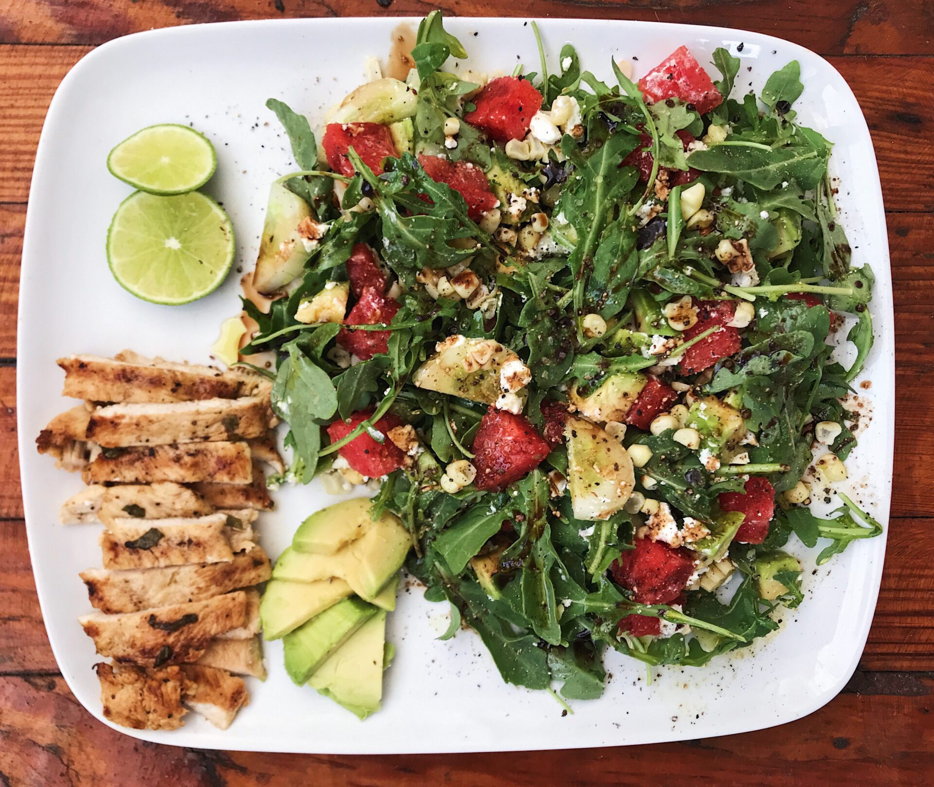 summer watermelon and arugula salad with grilled chicken breast and lime