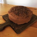 chocolate zucchini cake with dark chocolate frosting and chocolate shavings